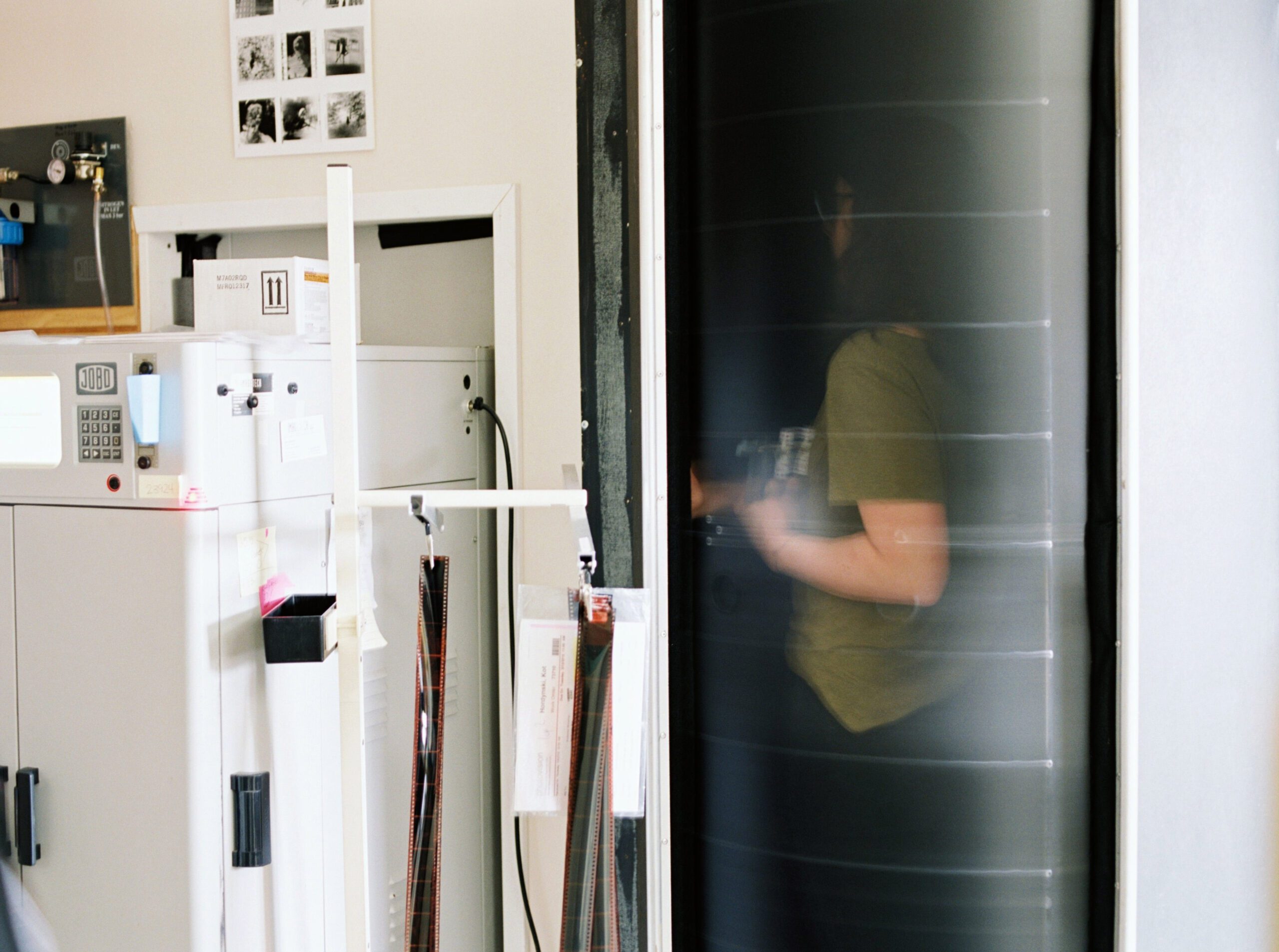 Film scanning process at a professional film lab ensuring consistent color and quality